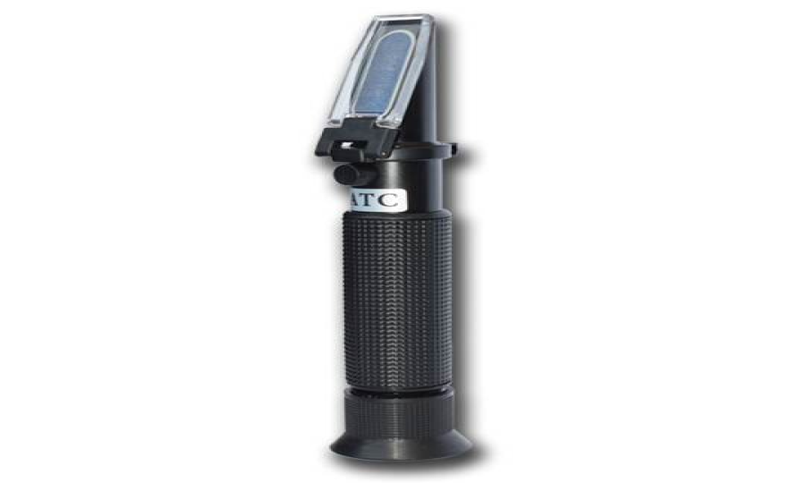 How does the sample stage of a sugar brix refractometer hold the sample?